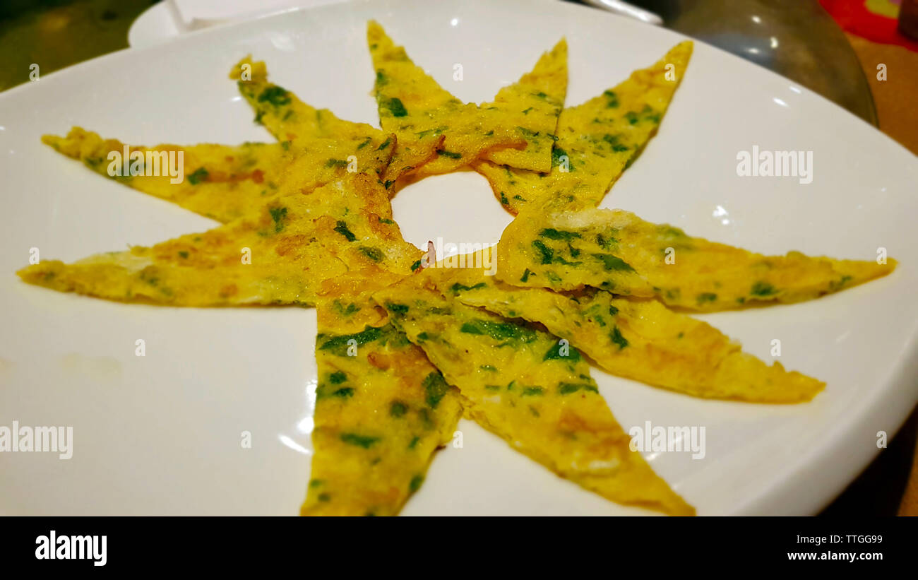 Omelette with vegetables. Dishes of Chinese cuisine from Yunnan Stock Photo