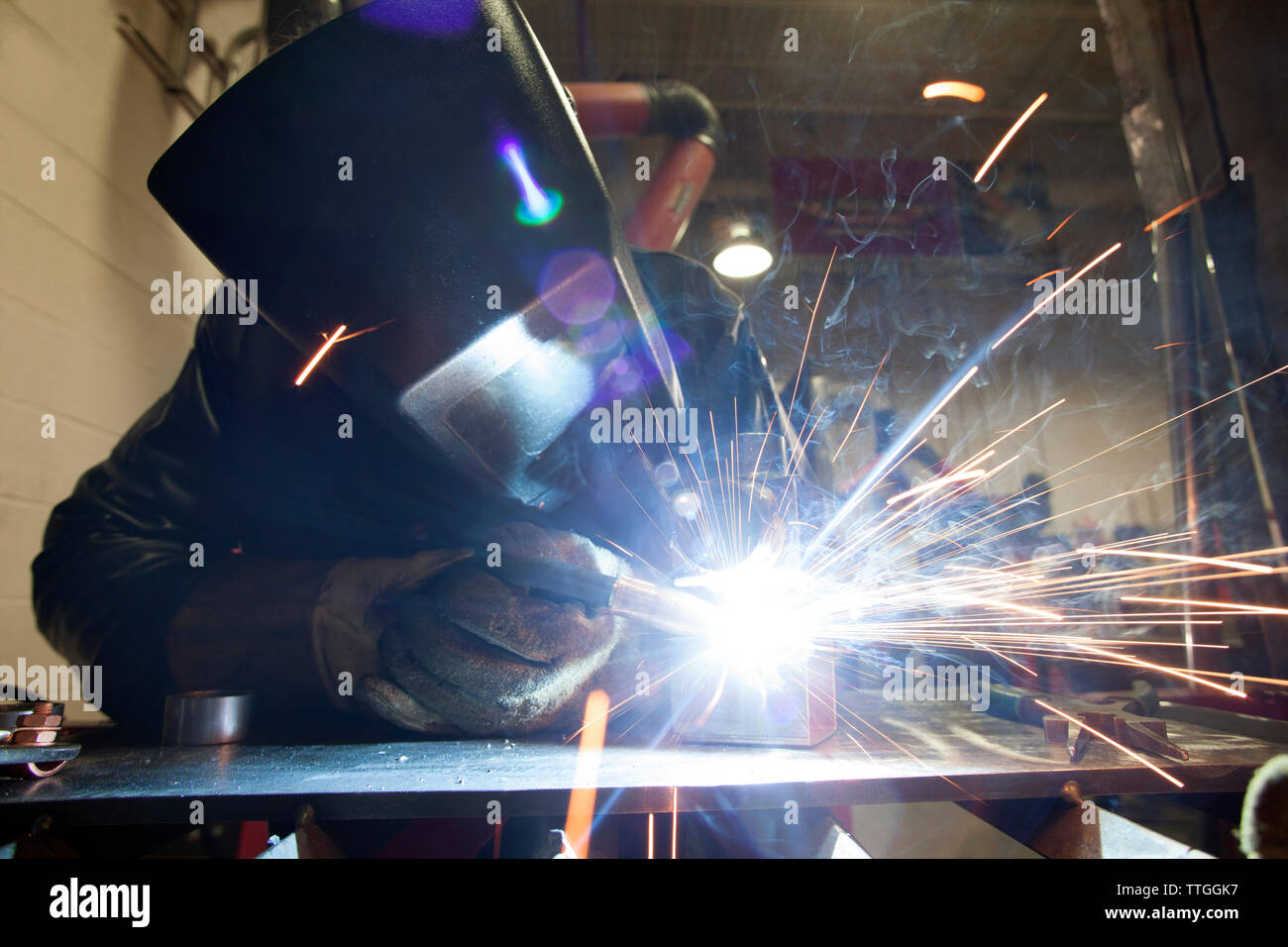 Manual worker using welding torch at Stock Photo Alamy