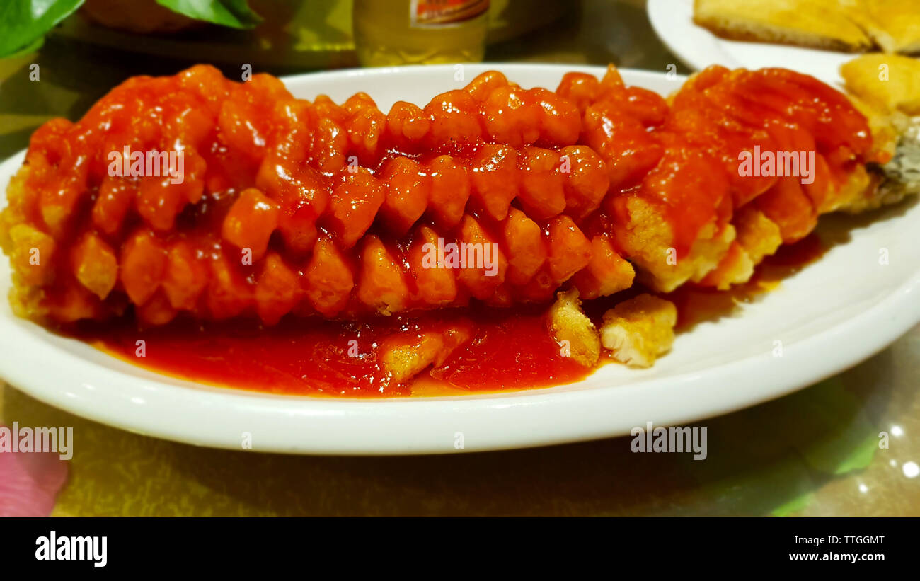 Fried fish in tomato sauce. Chinese dish from Yunnan. Chinese cuisine