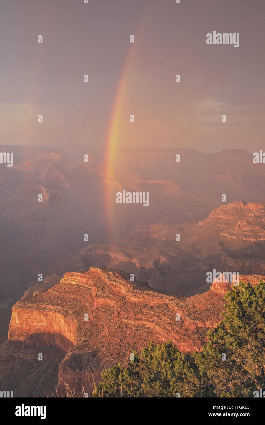 Rainbow over the Grand Canyon at sunset. Stock Photo