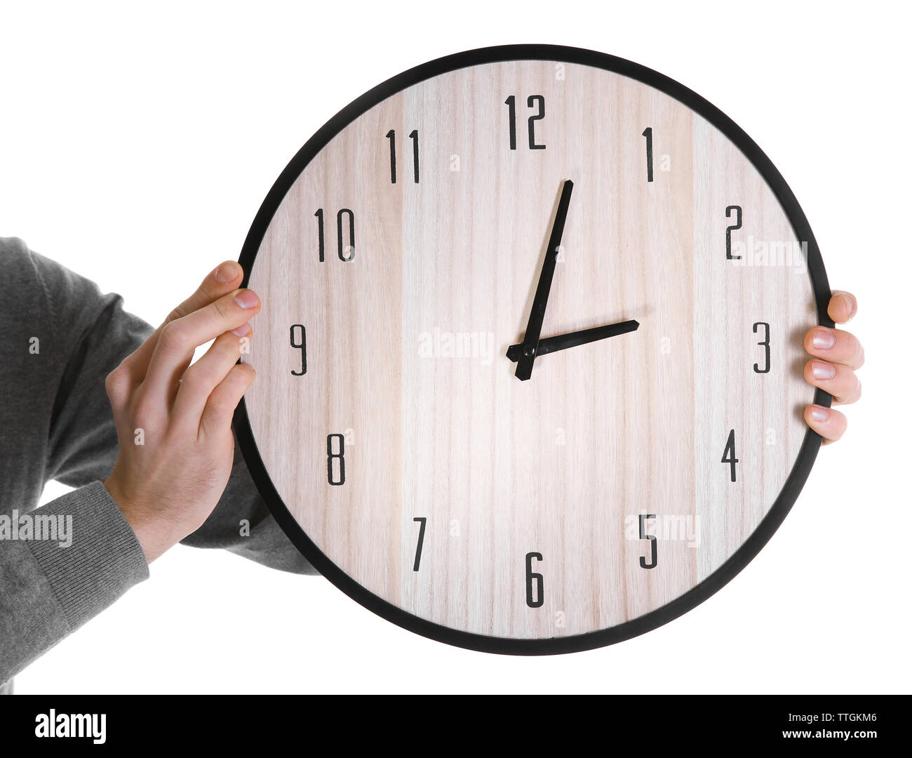 Man hands holding big round clock, isolated on white Stock Photo - Alamy