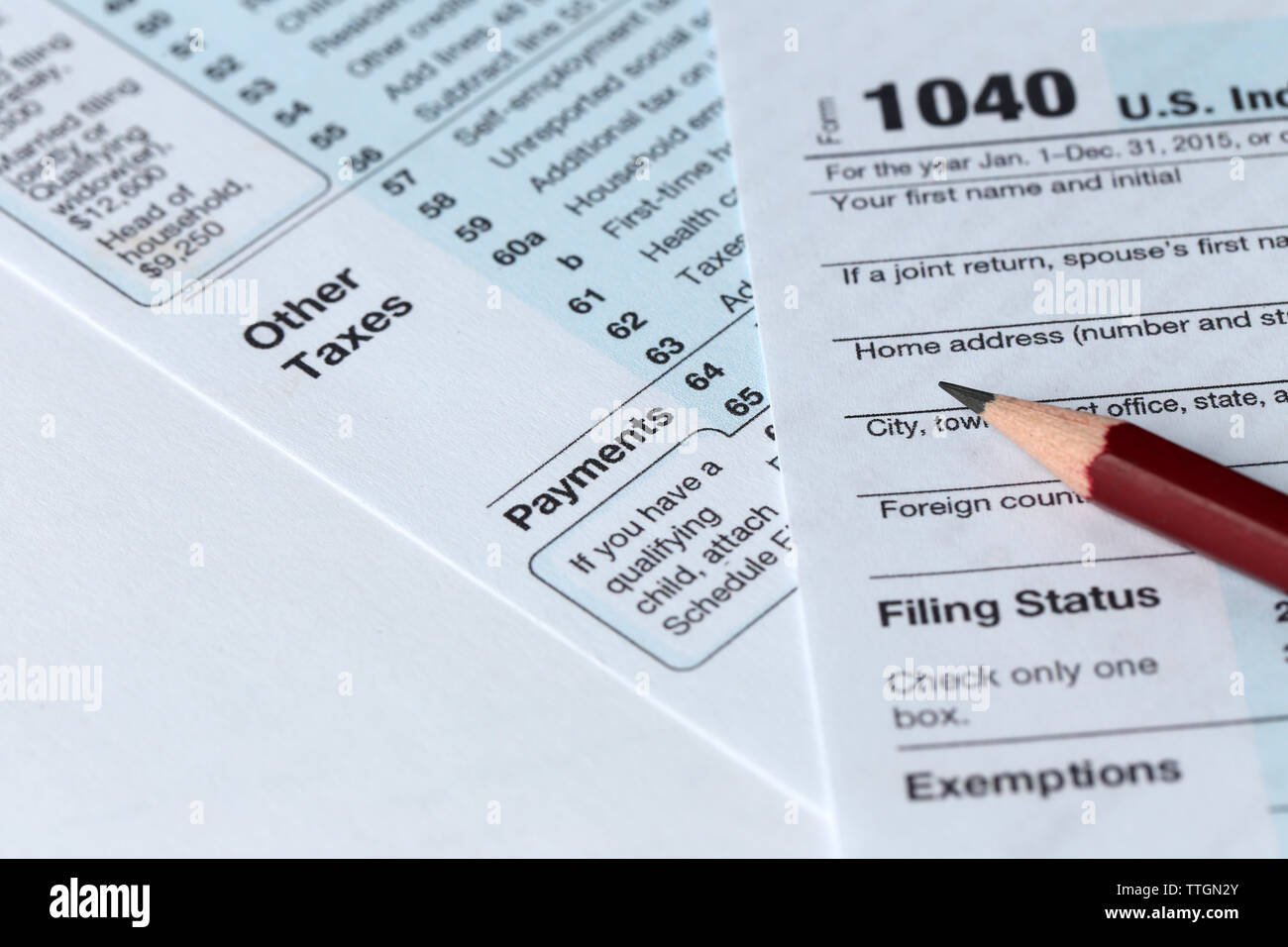 1040 Individual Income Tax Return Form for 2015 year with a pencil to ...