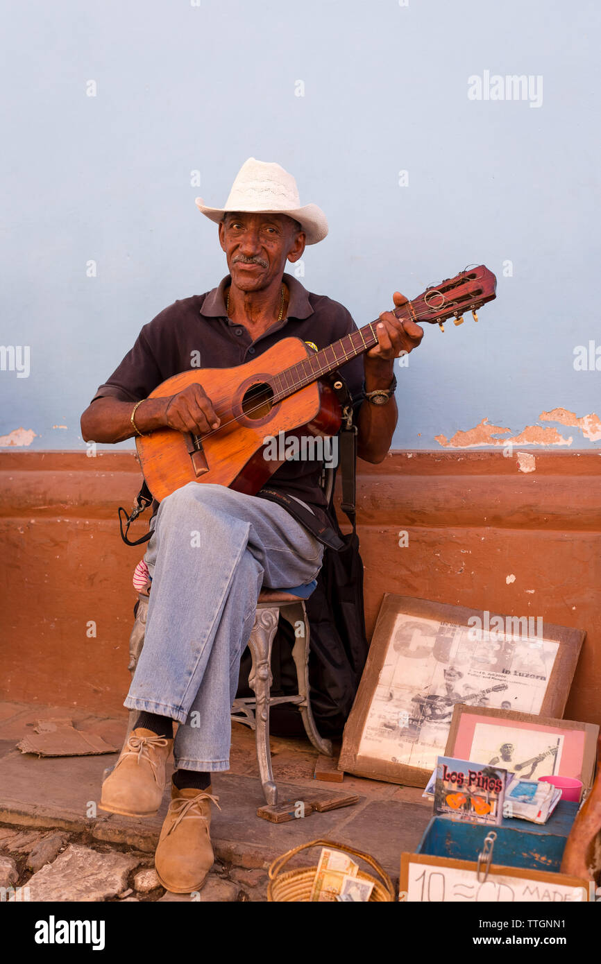 Musician playing on street. Real Life scene in Trinidad, Cuba. 2017. Stock Photo