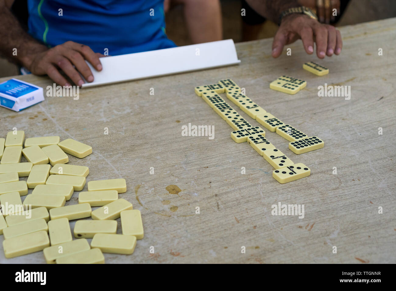 Gentlemen playing a mean game of dominoes. Trinidad, Cuba. 2017 Stock Photo