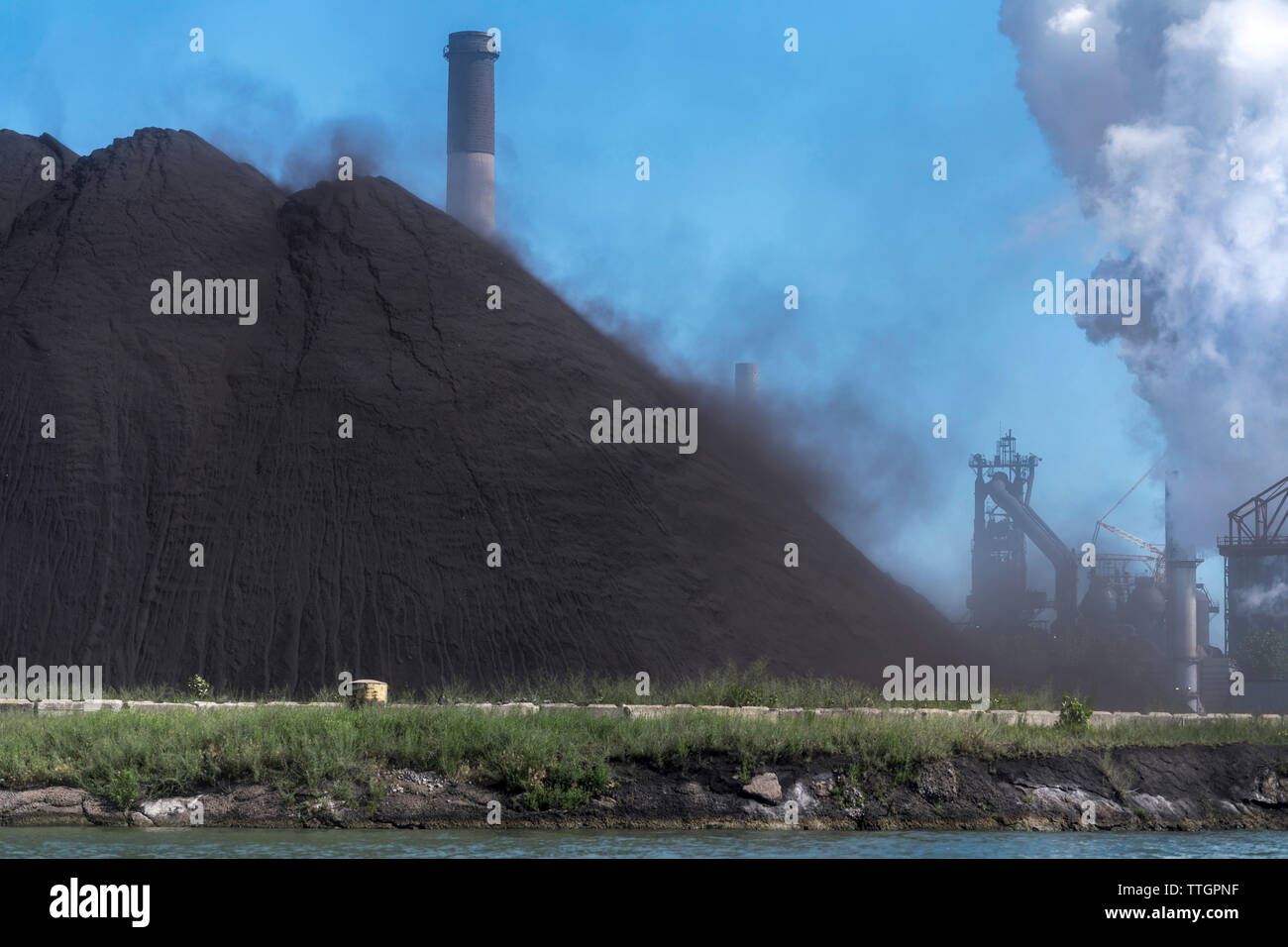 Coal Dust From Steel Mill Blowing Into Detroit River, Michigan Stock Photo
