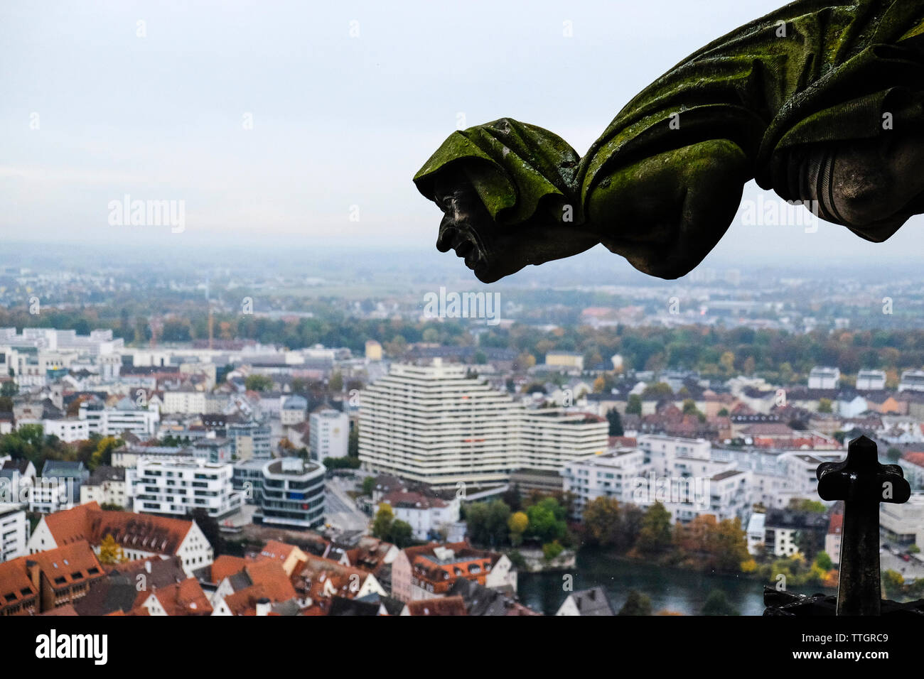 Gargoyle of Ulm Minster church by cityscape against sky Stock Photo