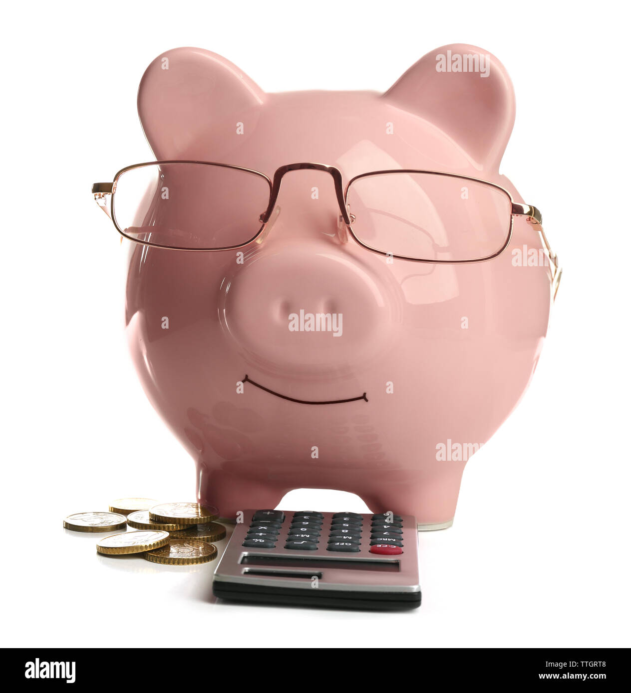 Pink piggy bank with coins, glasses and calculator, isolated on white ...