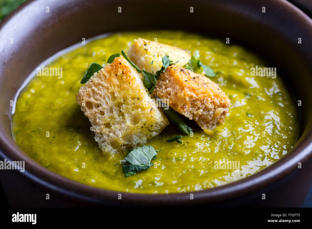 Green squash soup with crouton Stock Photo