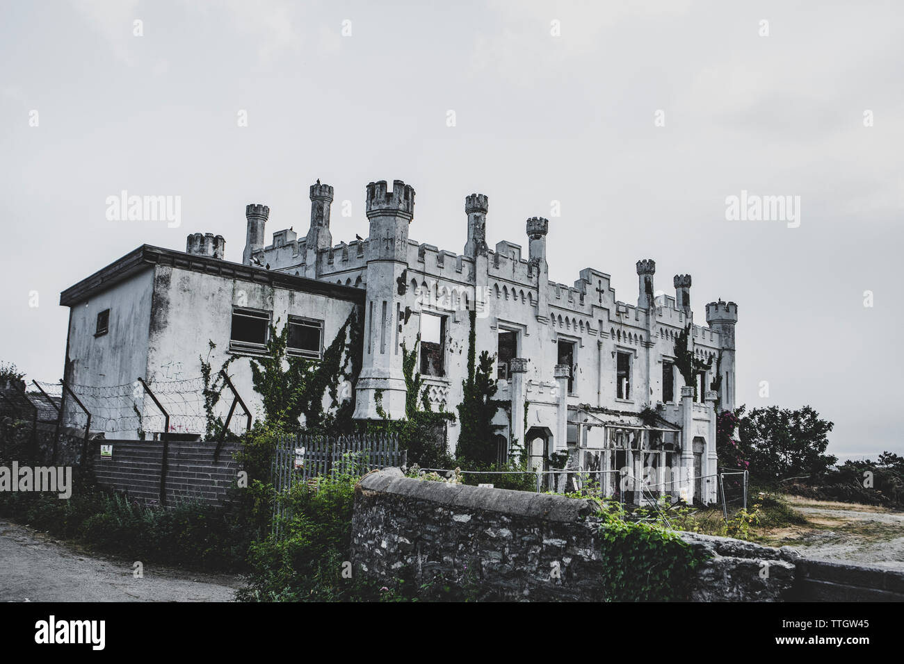 Old ruins of Soldiers Point House. White overgrown walls Stock Photo