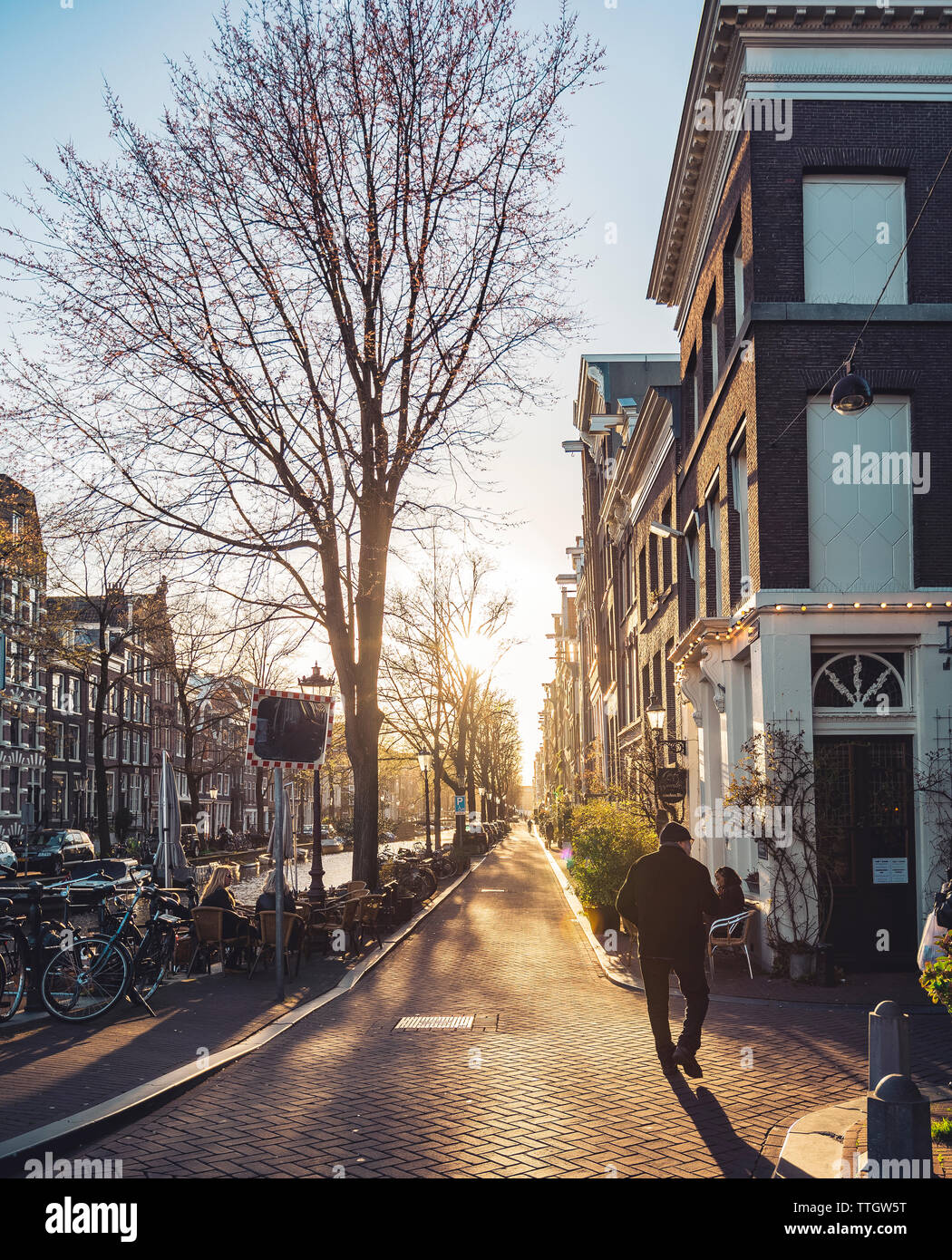 Sun setting over old town of Amsterdam. Stock Photo