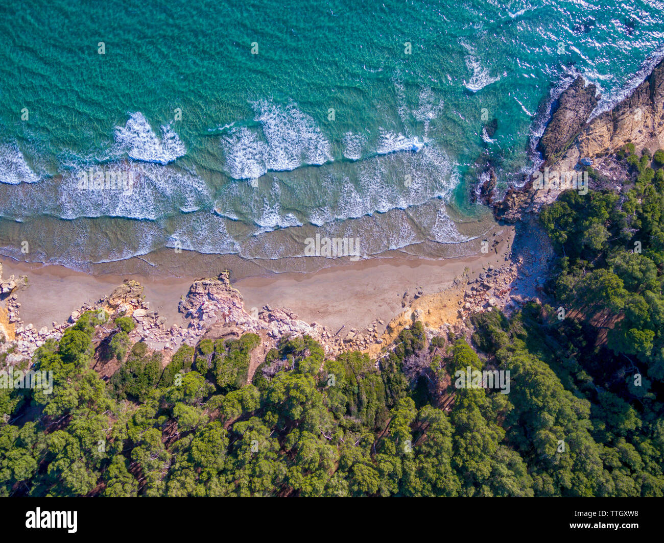 Aerial views of a coastline with waves and rocks in the Mediterranean Stock Photo