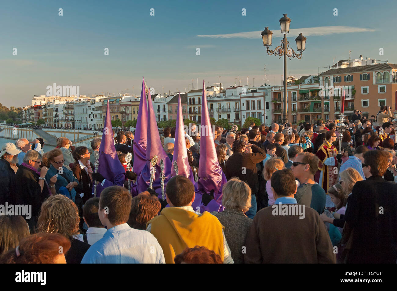 Holy Week. Brotherhood of La O (Nazarenes). Procession on the bridge of Triana. Seville. Region of Andalusia. Spain. Europe Stock Photo