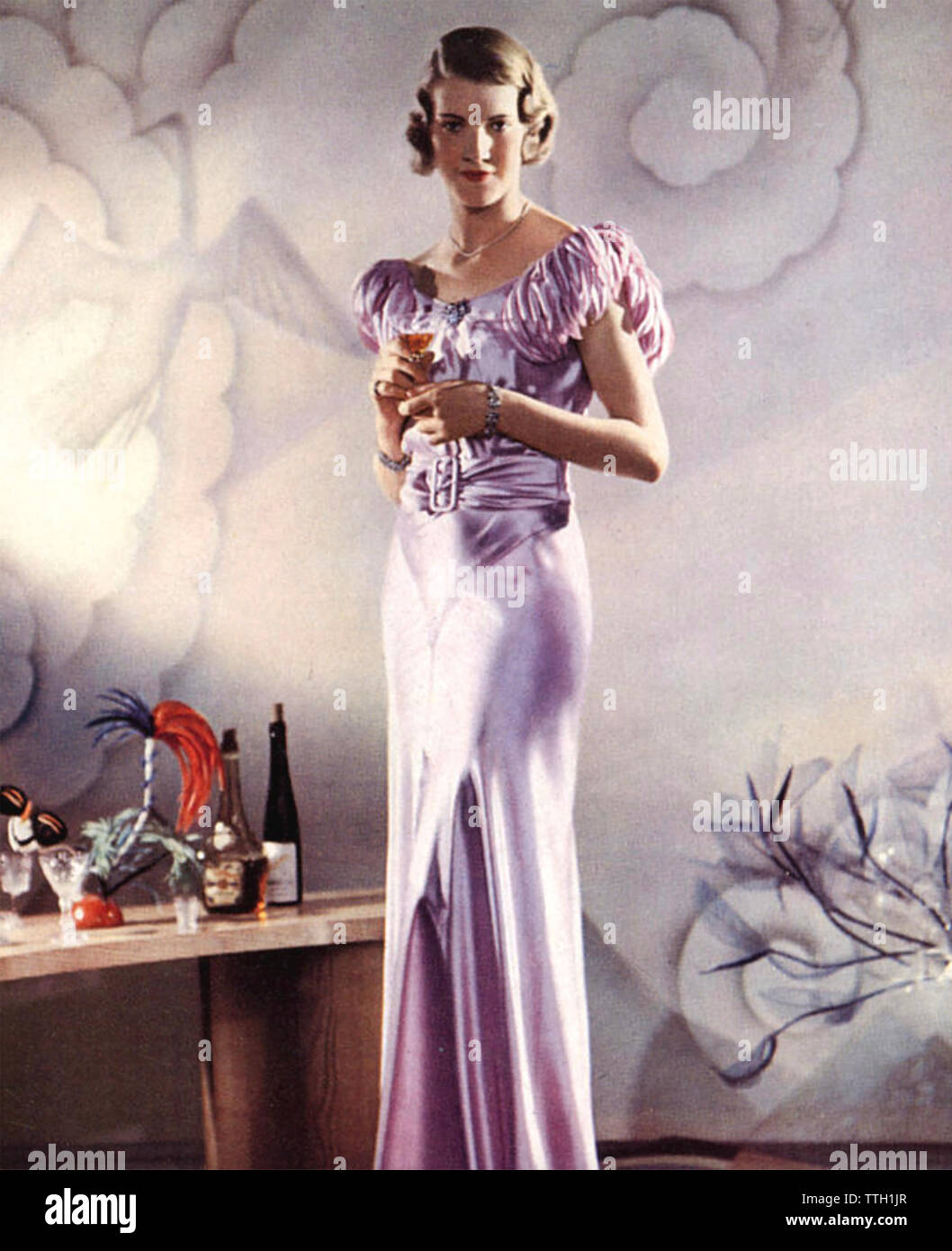 EVENING WEAR ABOUT  1922 in a satin dress Stock Photo