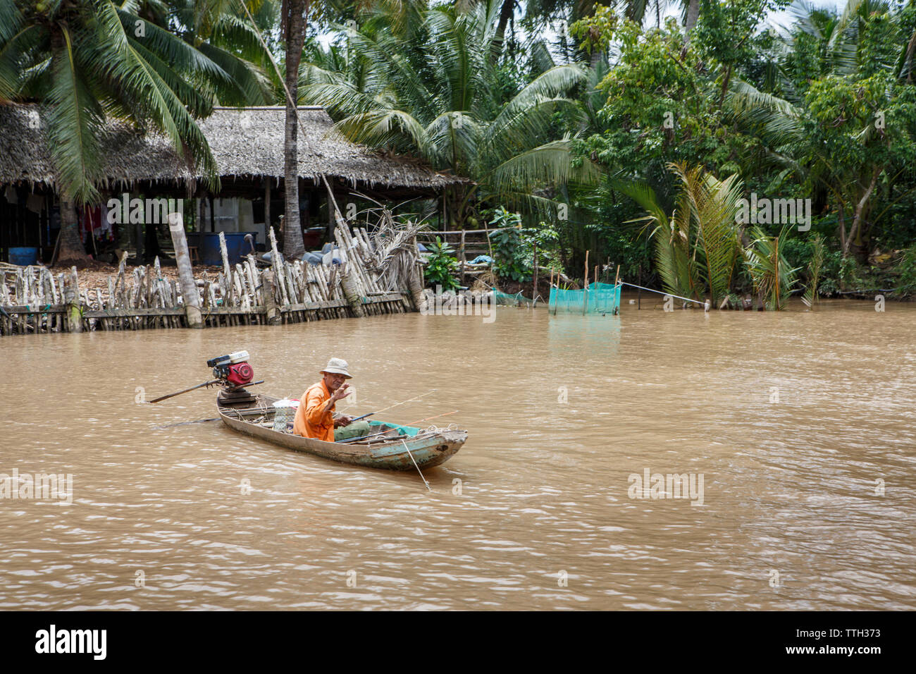 A fisherman in Vietnam's Mekong Delta region Stock Photo - Alamy