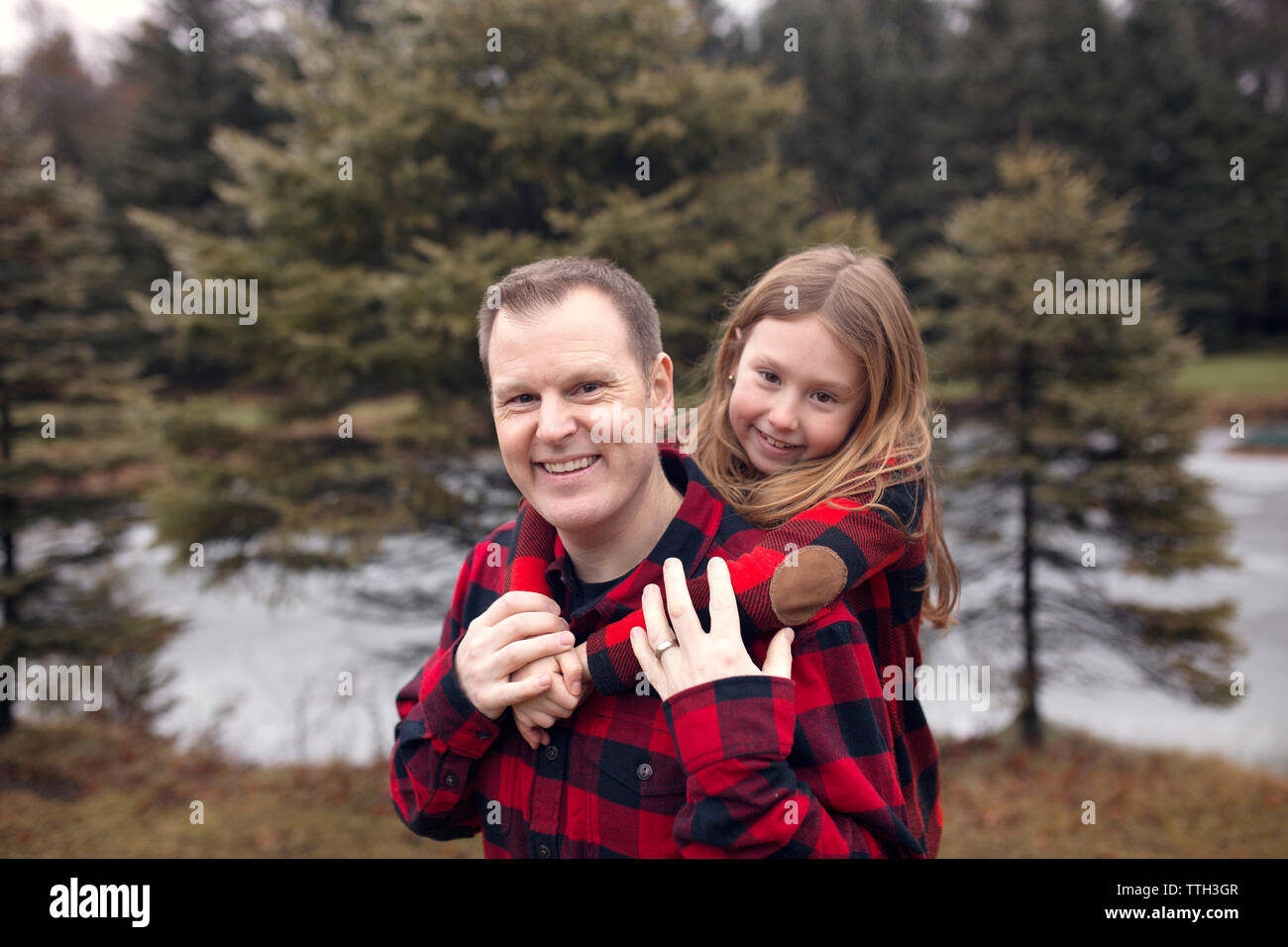 Family in Matching Red Plaid Stock Photo - Alamy
