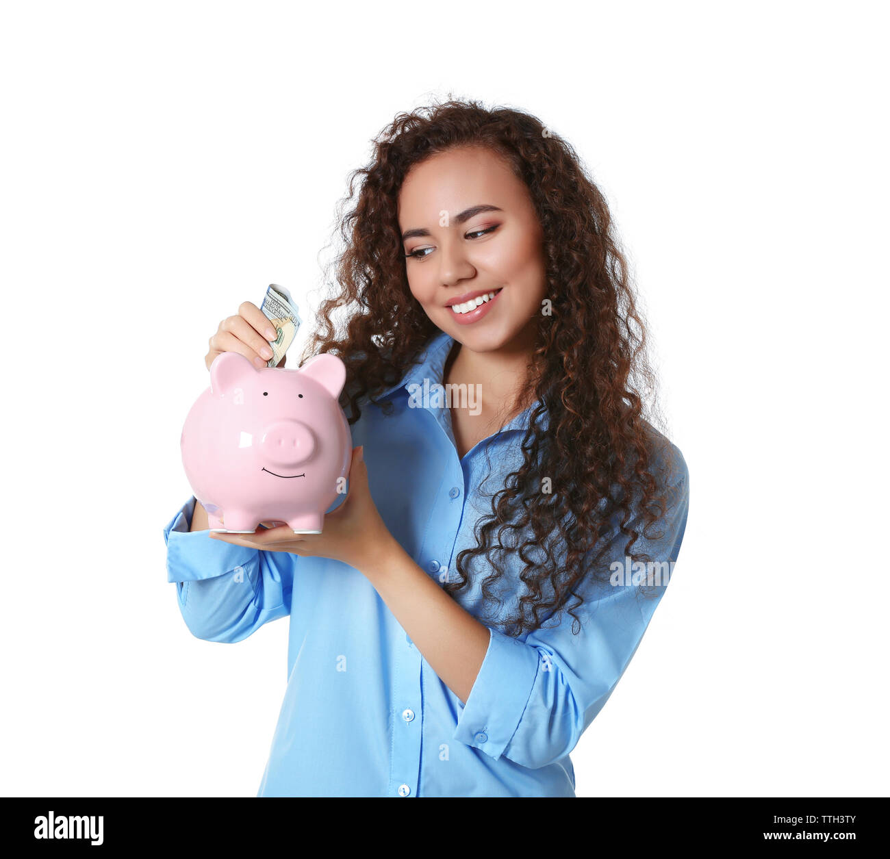 Beautiful young girl holding piggy bank, isolated on white Stock Photo ...