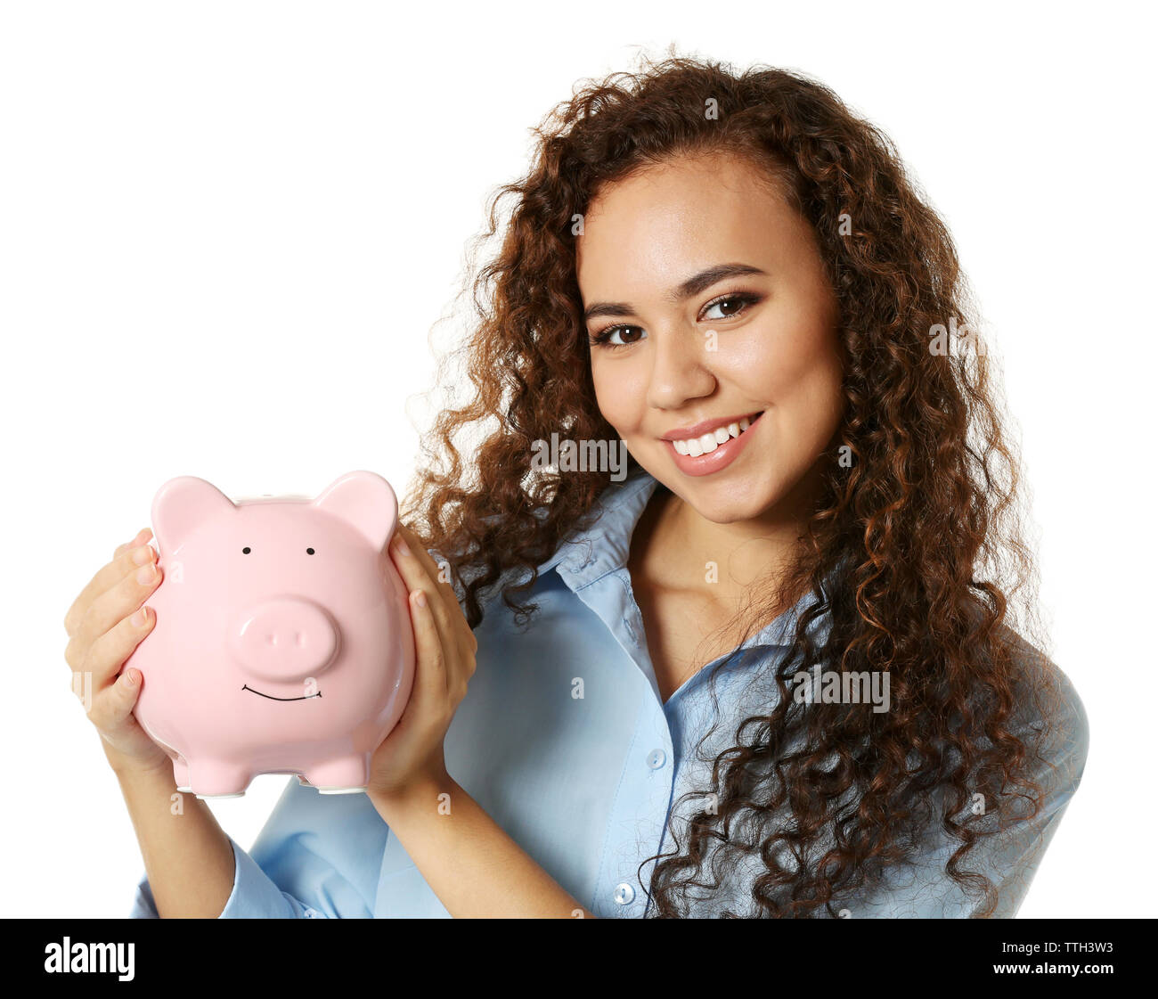 Beautiful young girl holding piggy bank, isolated on white Stock Photo ...