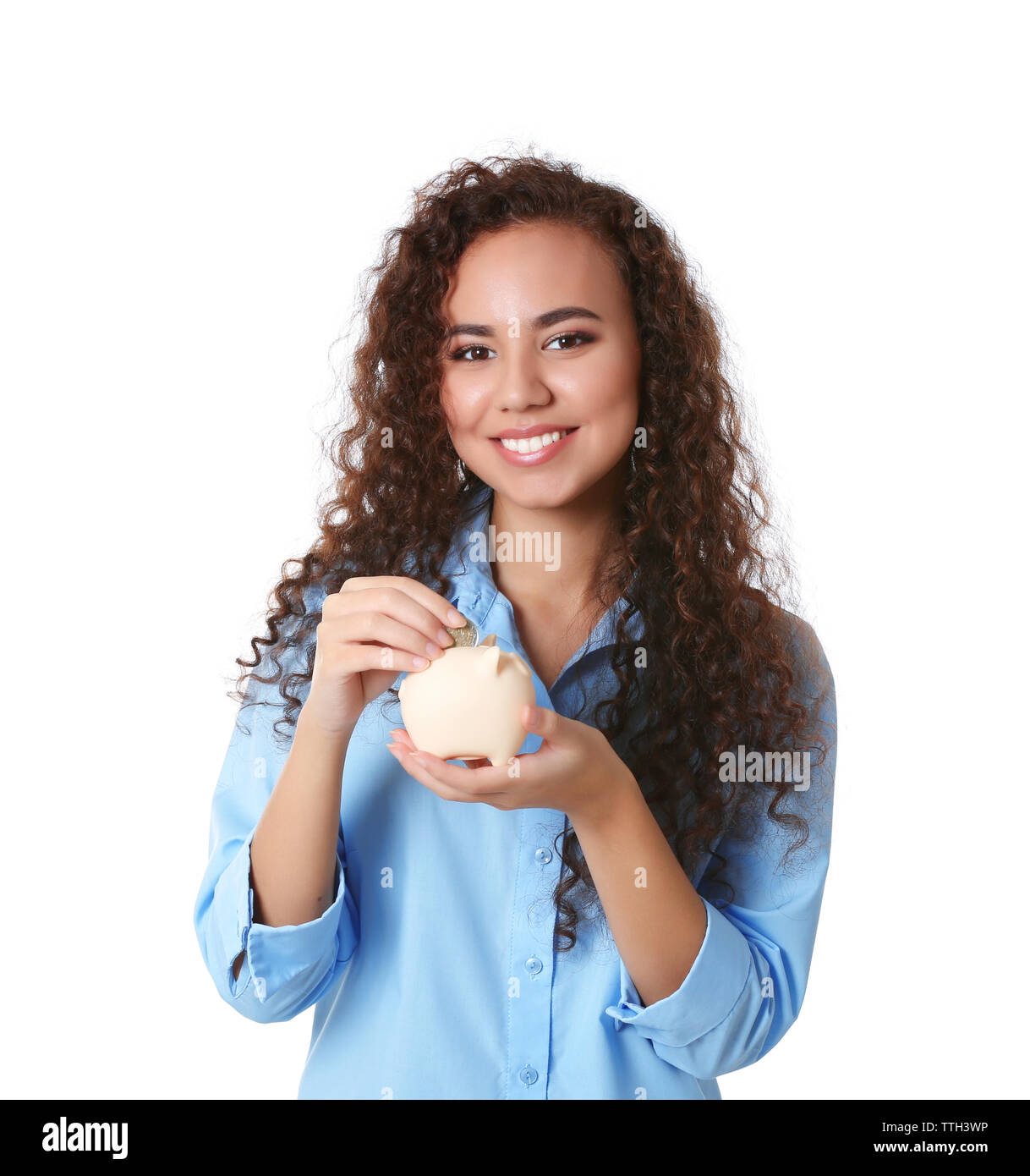 Beautiful young girl holding piggy bank, isolated on white Stock Photo ...