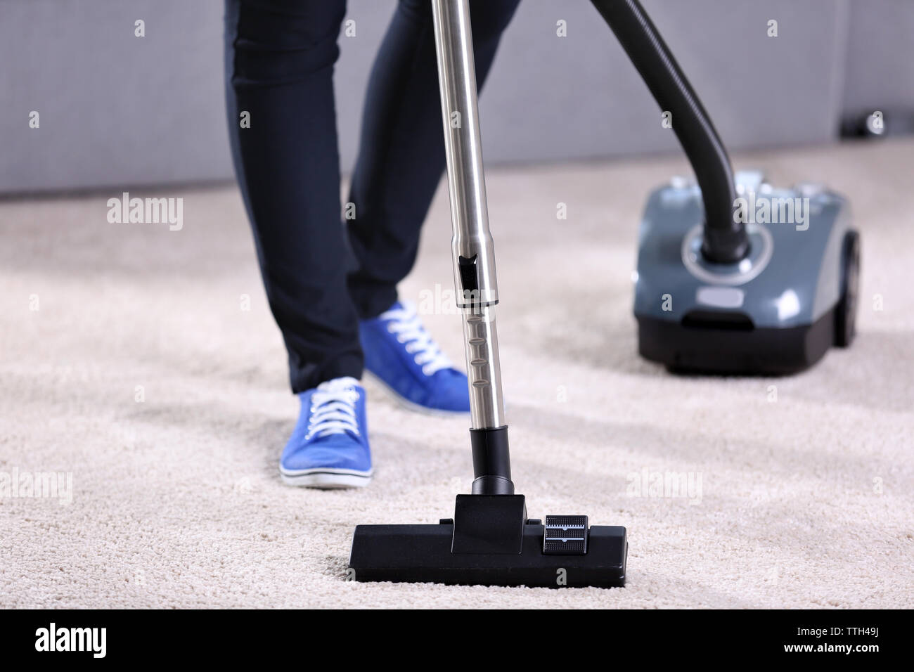 Woman using vacuum cleaner hi-res stock photography and images - Alamy
