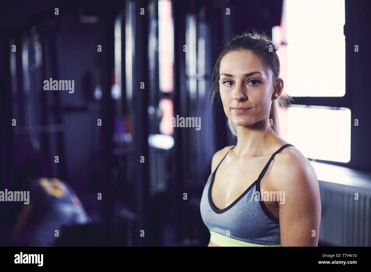 Portrait of young attractive woman at the fitness centre Stock Photo