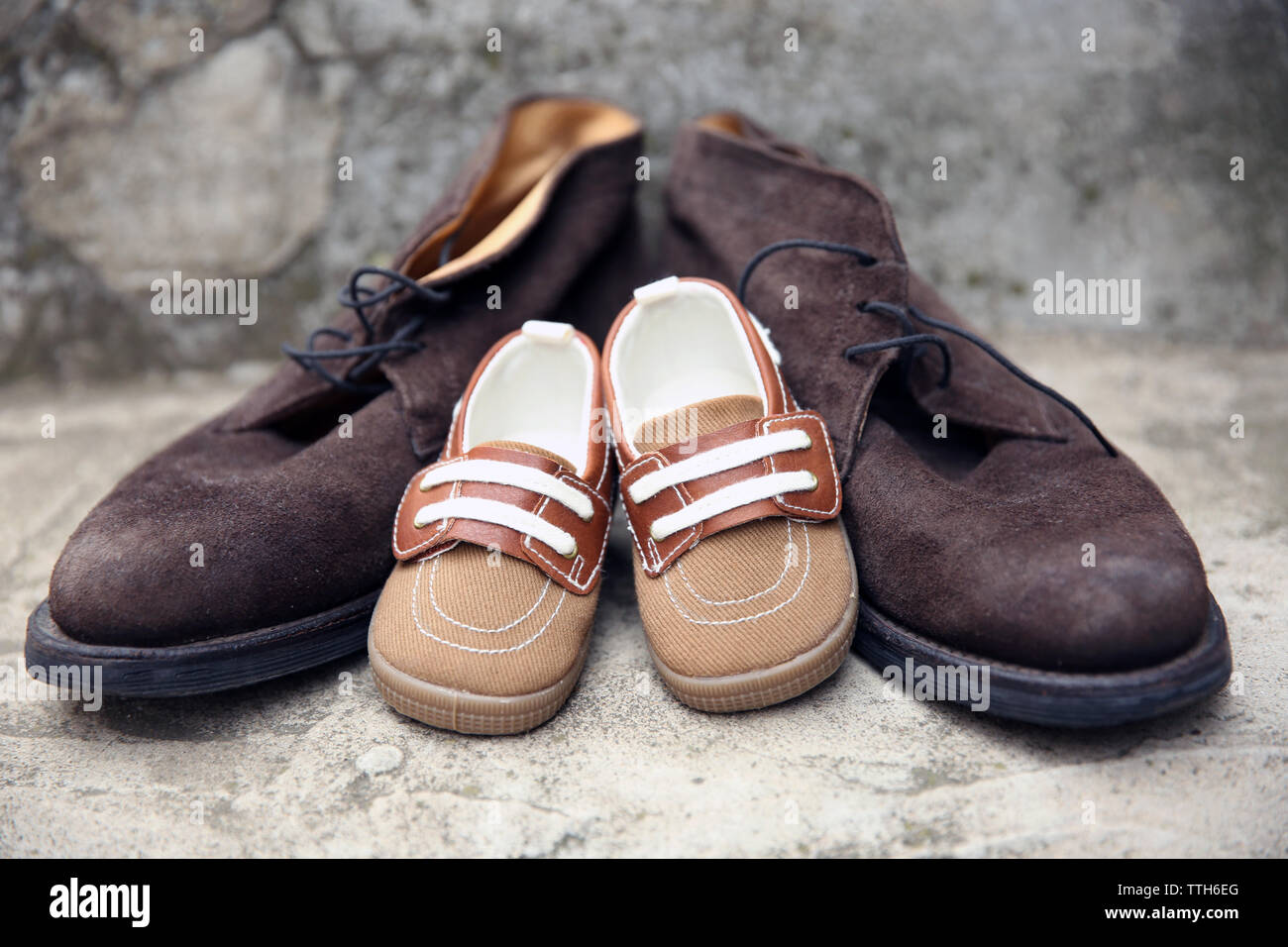 Father and son shoes on concrete stairs Stock Photo Alamy
