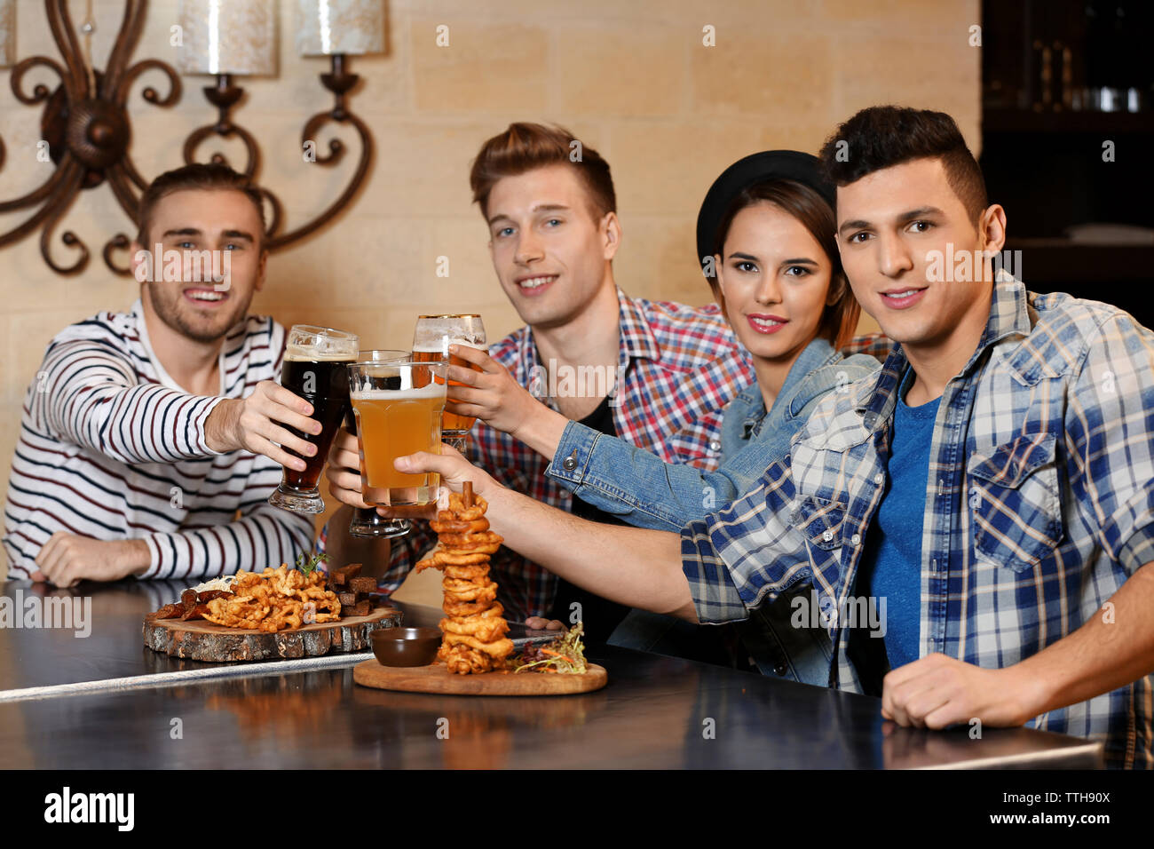 Bar Spend Group of young people spending time in bar Stock Photo - Alamy