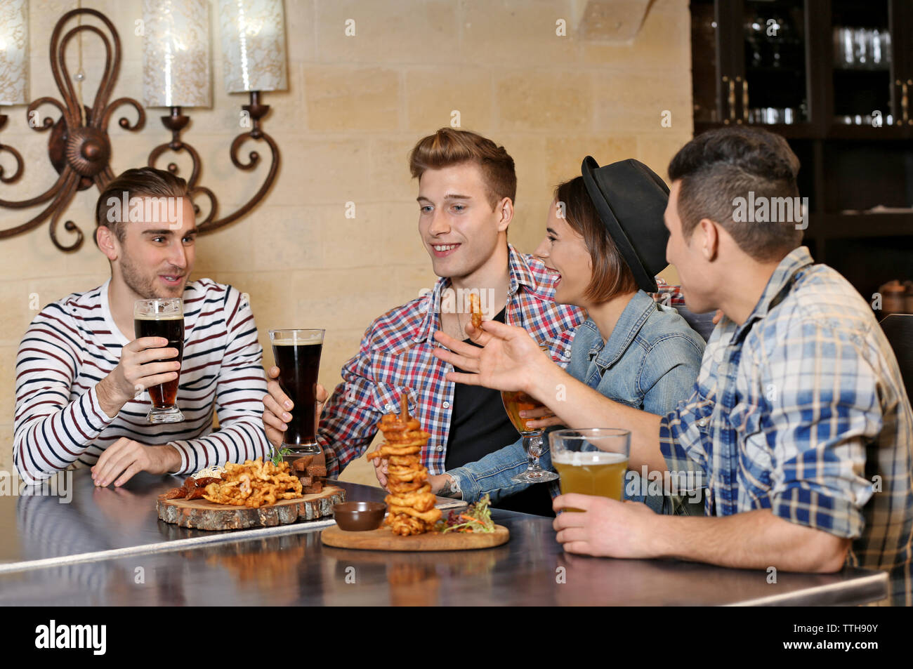 Bar Spend Group of young people spending time in bar Stock Photo - Alamy