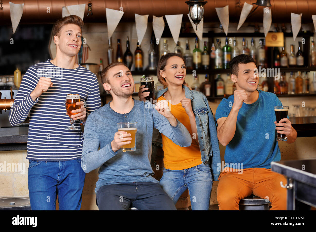Bar Spend Group of young people spending time in bar Stock Photo - Alamy