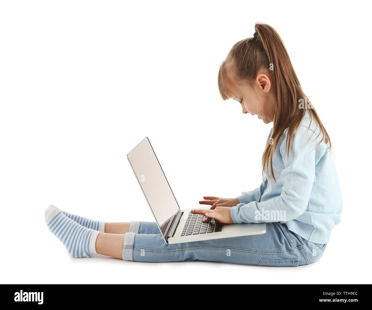Little girl with laptop isolated on white Stock Photo - Alamy