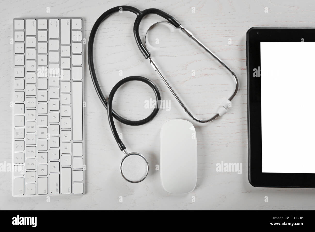 Tablet, keyboard and stethoscope on the table, top view Stock Photo - Alamy