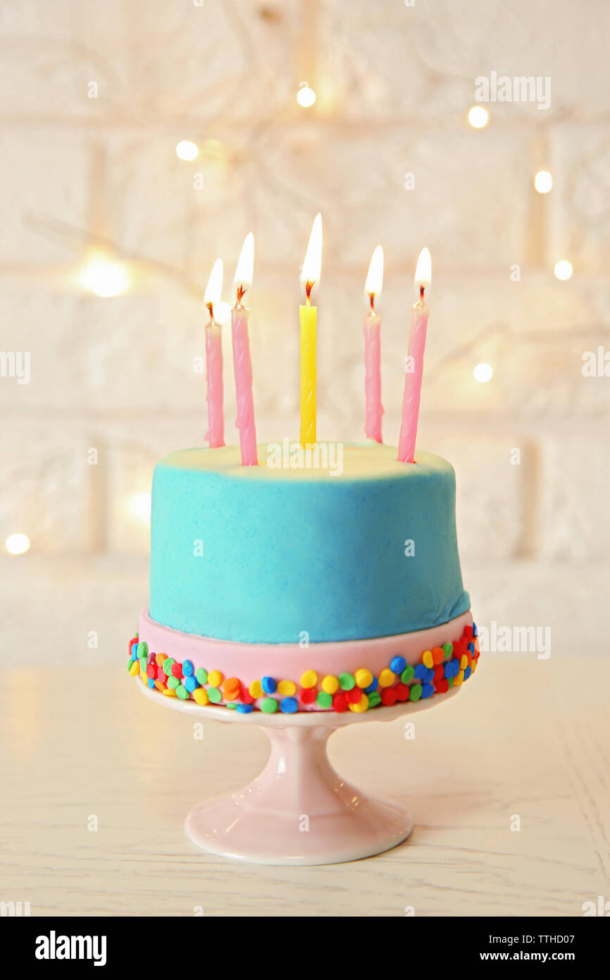 Birthday cake with candles on white background Stock Photo - Alamy