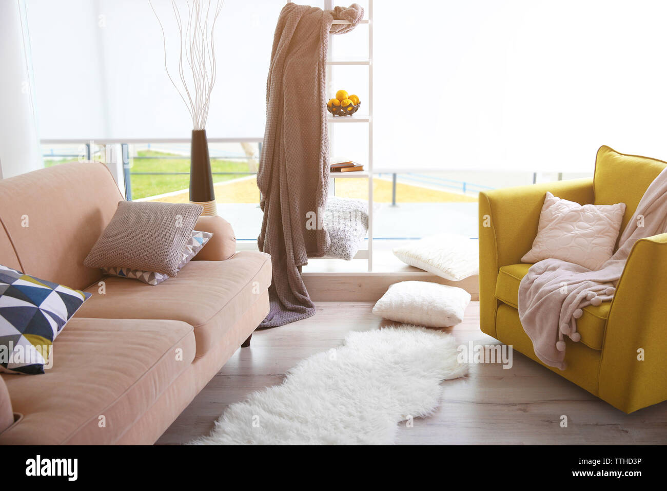 Modern living room design with sofa and armchair Stock Photo - Alamy