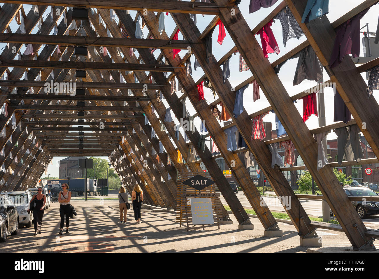 Oslo Norway, view of an art installation composed of hanging shirts on the site of the Salt Nomadic Art Project in the harbor area of Oslo, Norway. Stock Photo