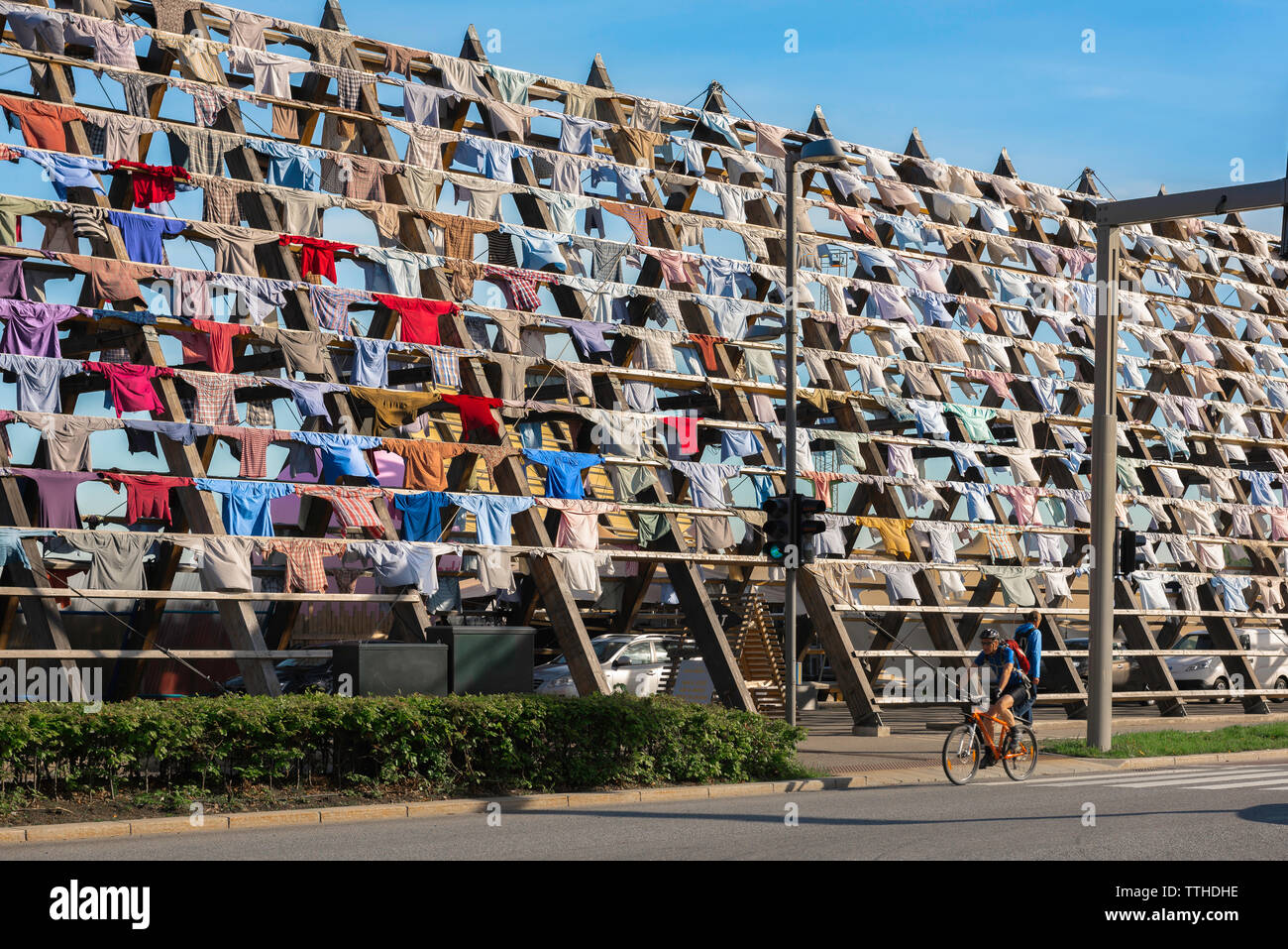 View of an art installation composed of hanging shirts on the site of the Salt Nomadic Art Project in the harbor area of Oslo, Norway. Stock Photo