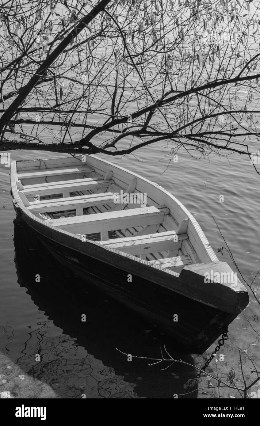 Boat on the bank of the river with clear water Stock Photo - Alamy