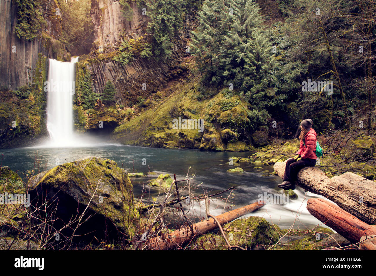 Female hiker sitting waterfall hi-res stock photography and images - Alamy