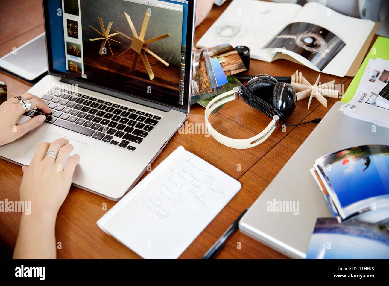 Cropped image of businesswoman working on laptop at desk Stock Photo