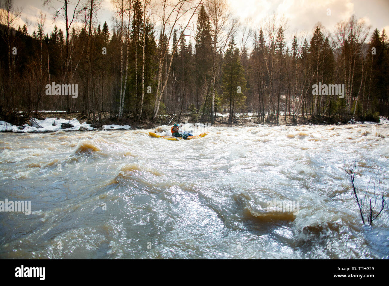 Man enjoying rafting in river Stock Photo