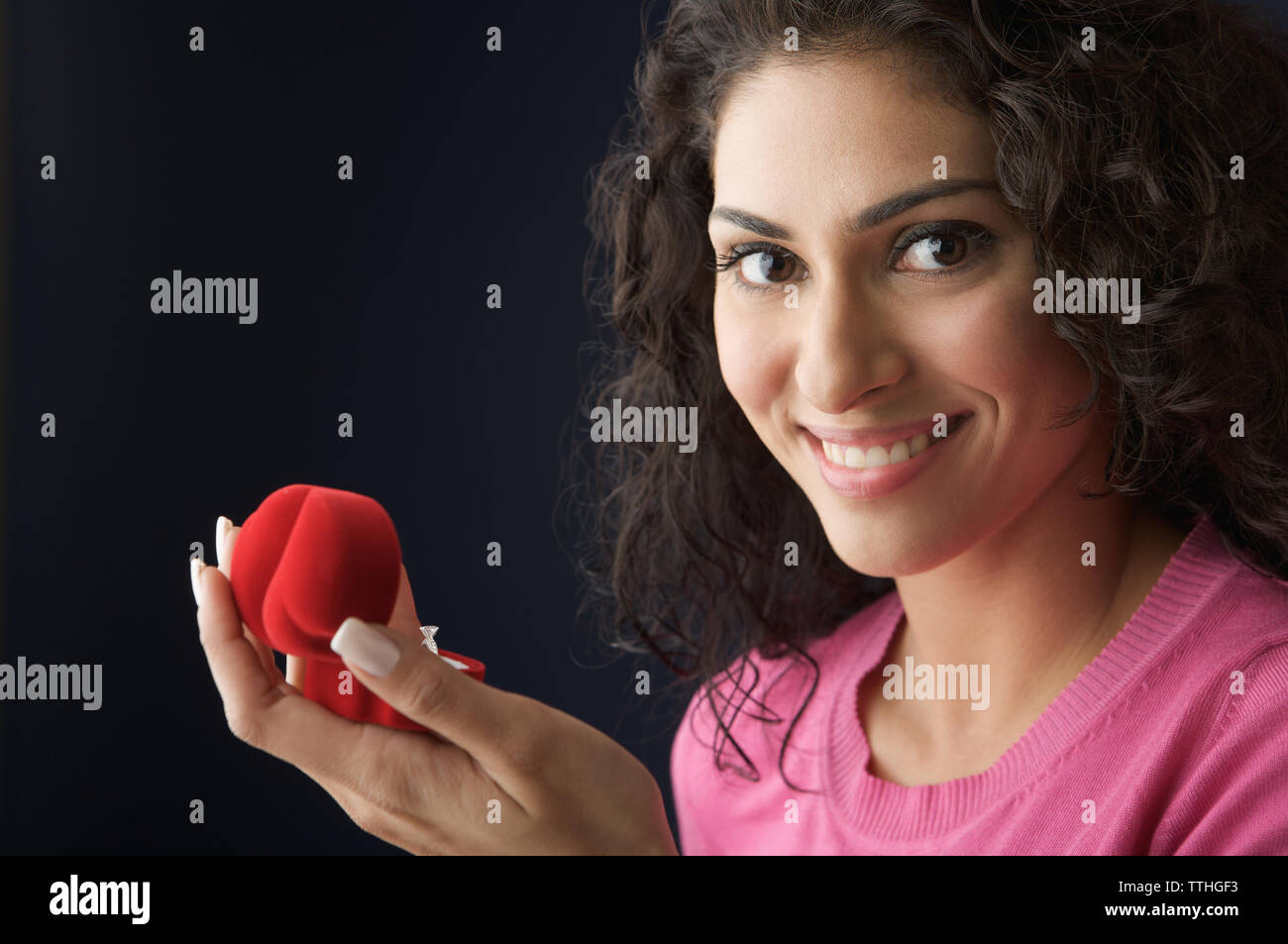 Woman Holding A Ring In A Box And Smiling Stock Photo Alamy