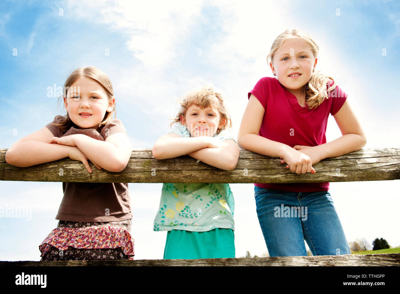 Three girls standing against hi-res stock photography and images - Alamy