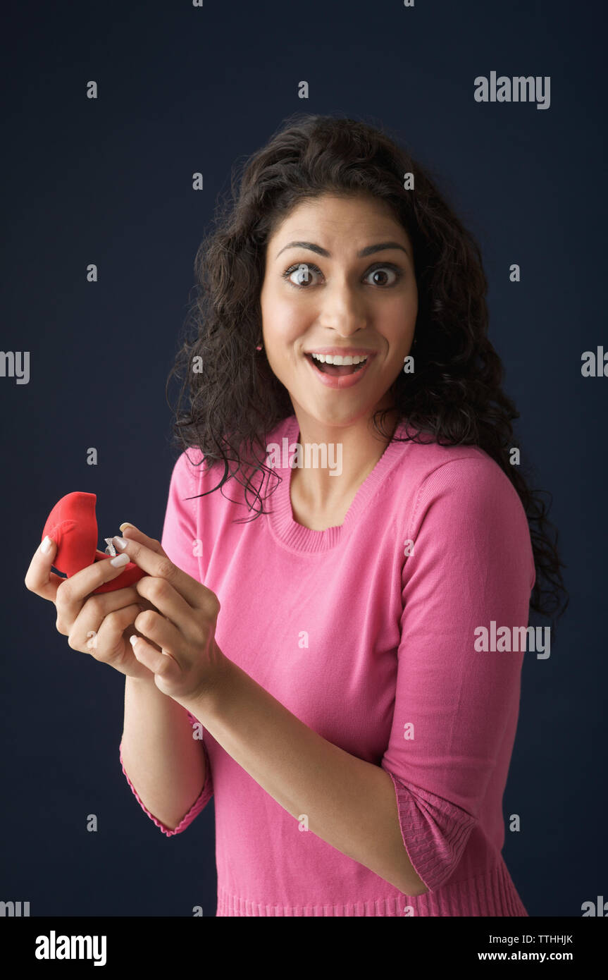 Portrait of a woman a ring in a box and smiling Stock Photo - Alamy