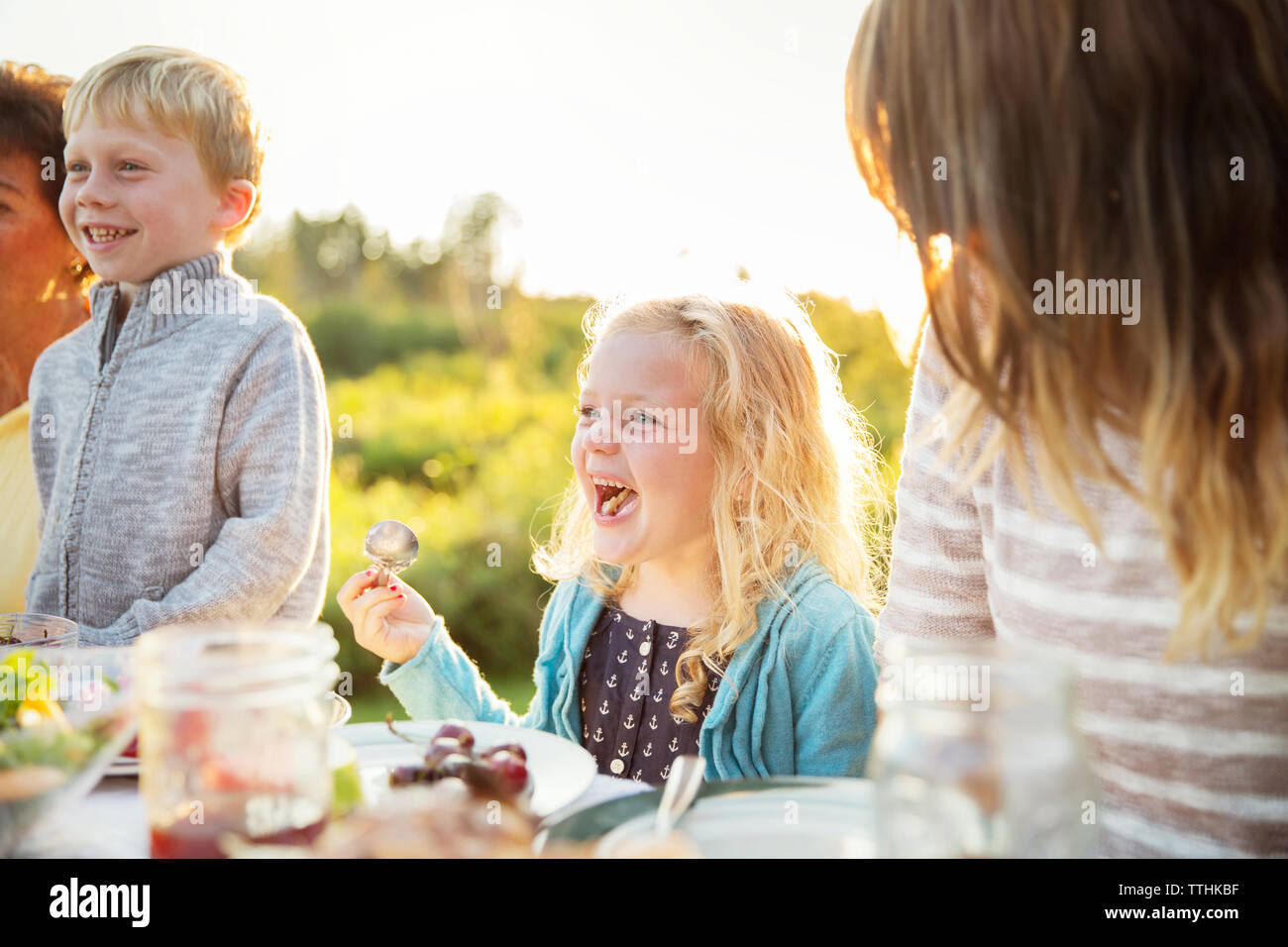 Boy girl picnic table hi-res stock photography and images - Alamy