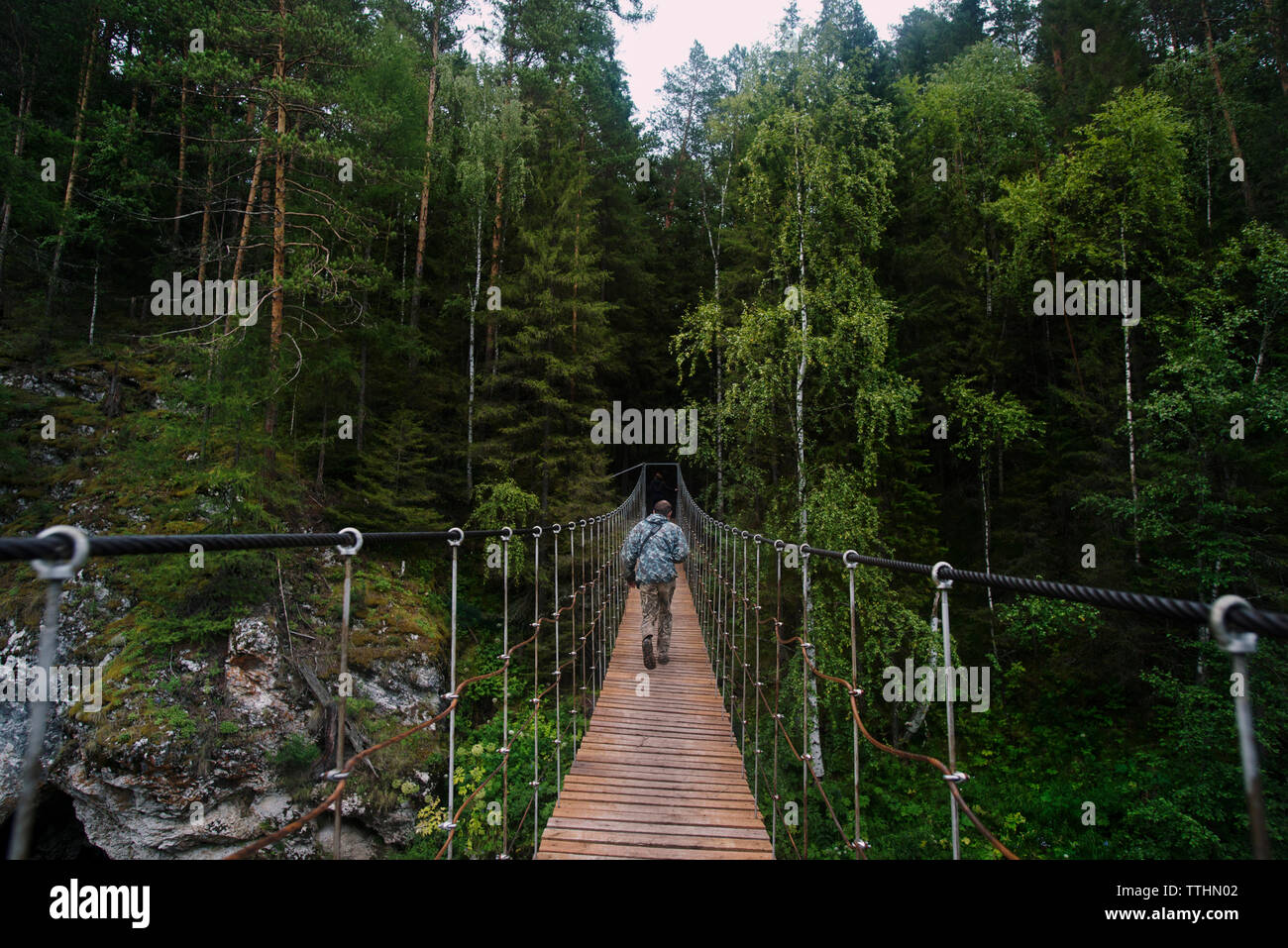 Man walking on bridge hi-res stock photography and images - Alamy