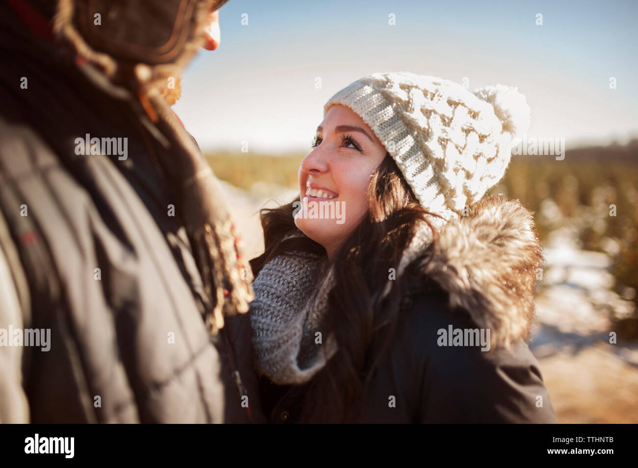 Close-up of happy couple at field on sunny day Stock Photo