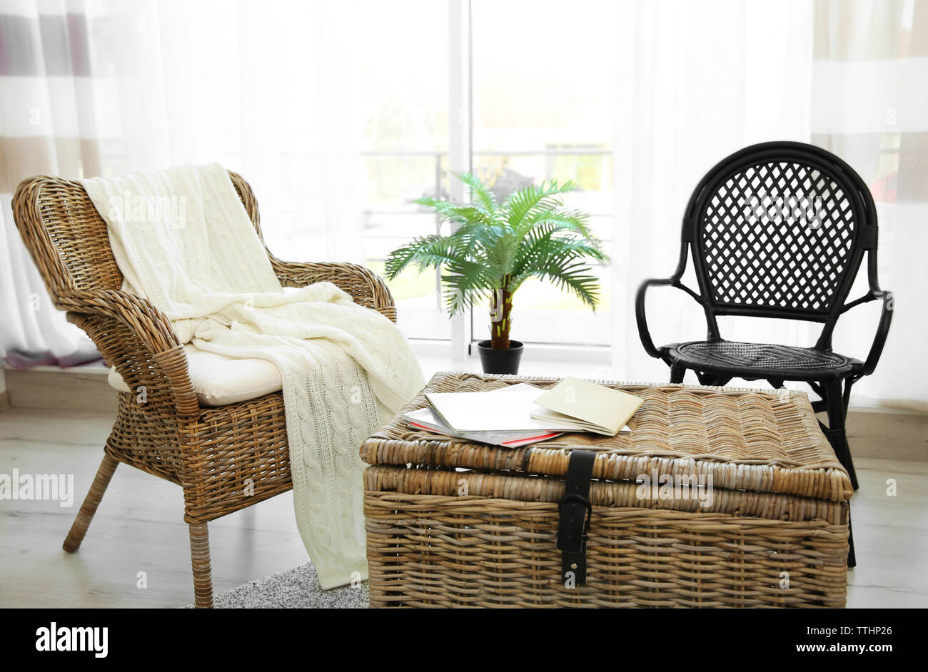 Modern living room interior with wicker furniture Stock Photo - Alamy
