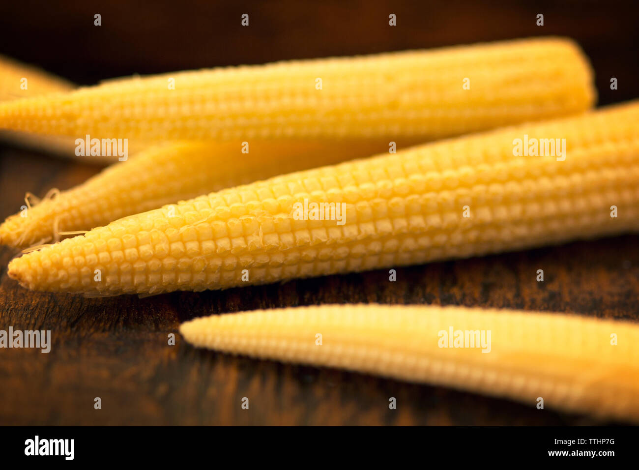 Close-up of baby corns on table Stock Photo