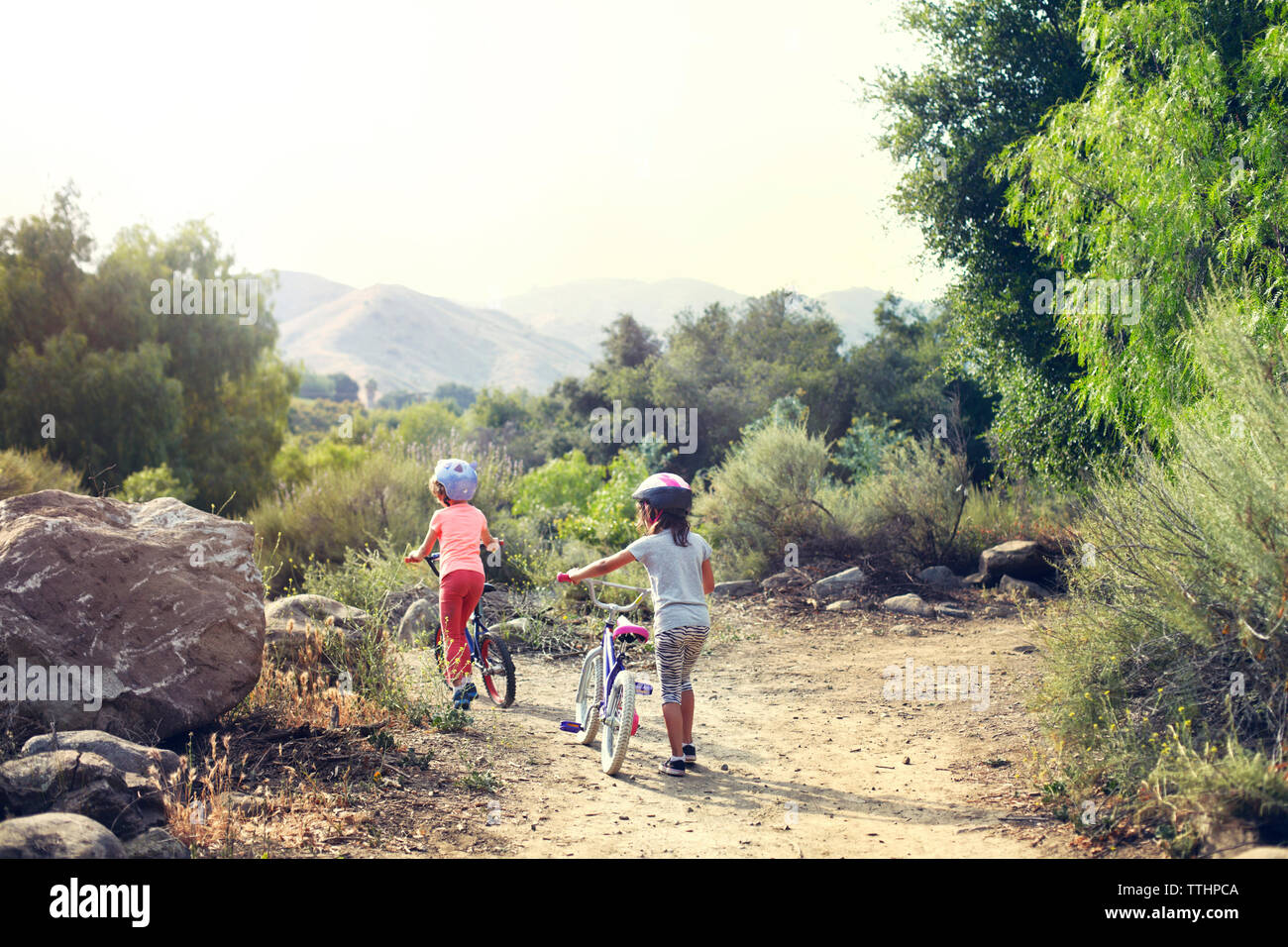 Rear view two girls walking hi-res stock photography and images - Alamy