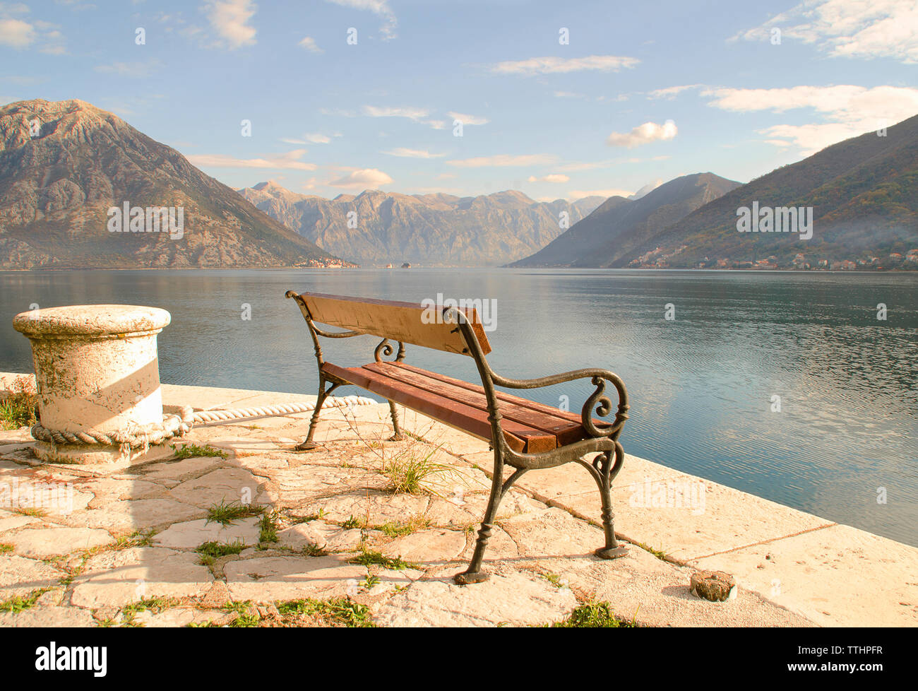 View of Kotor Bay looking towards Perast village and Lovcen Mountain, Montenegro, Europe. Stock Photo