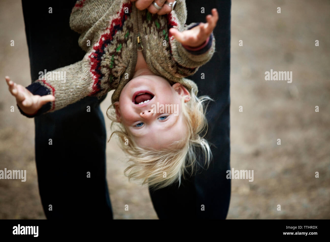 Man holding boy upside down hi-res stock photography and images - Alamy
