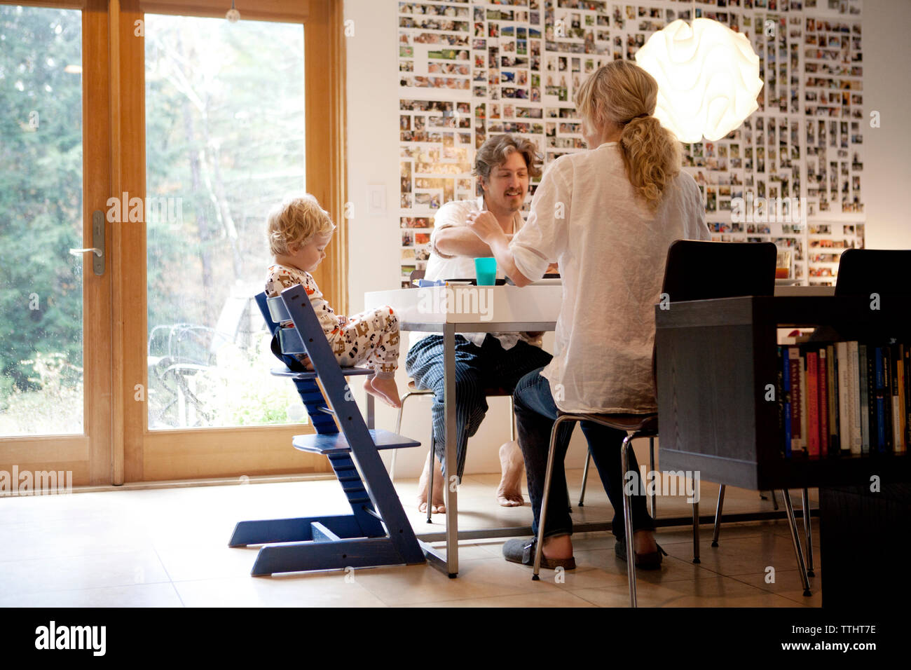 Family having breakfast at table in home Stock Photo